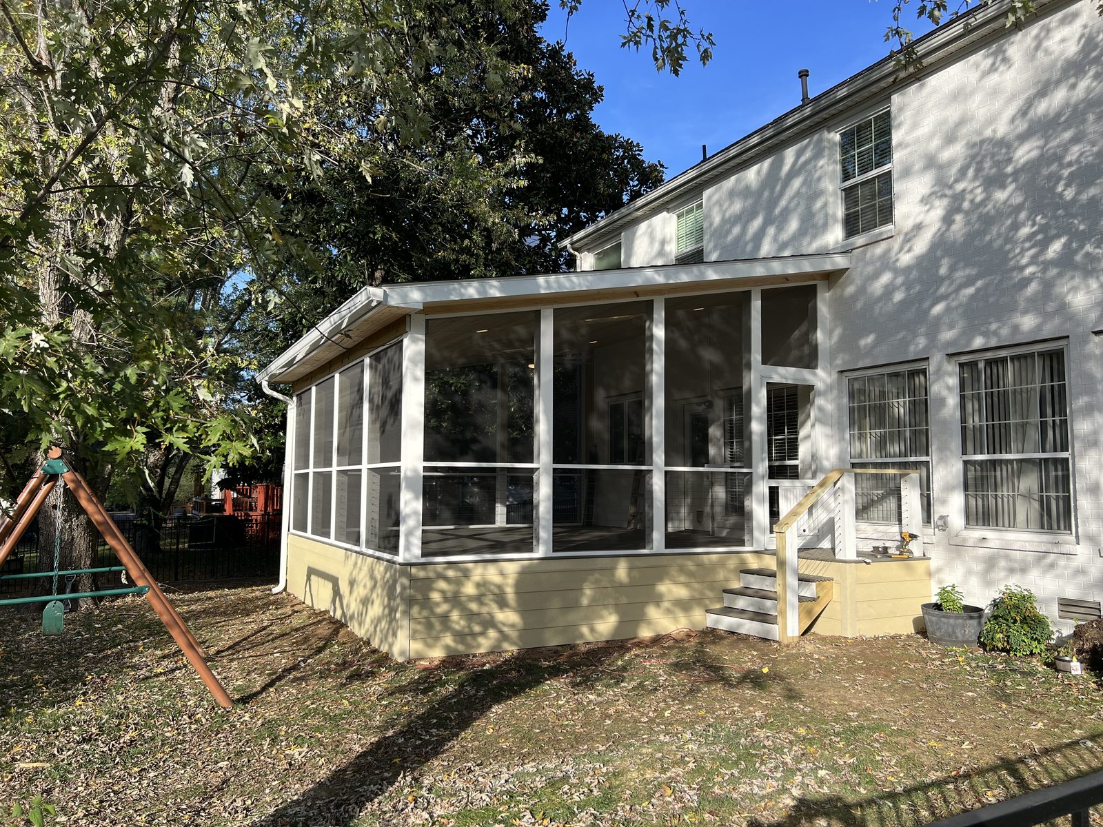 White screened porch sunroom addition