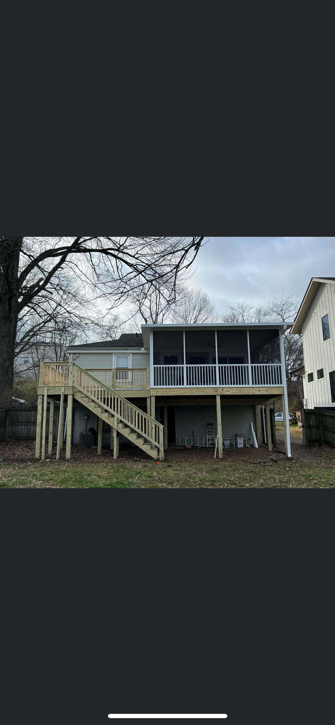 Elevated screened porch and open deck with stairs